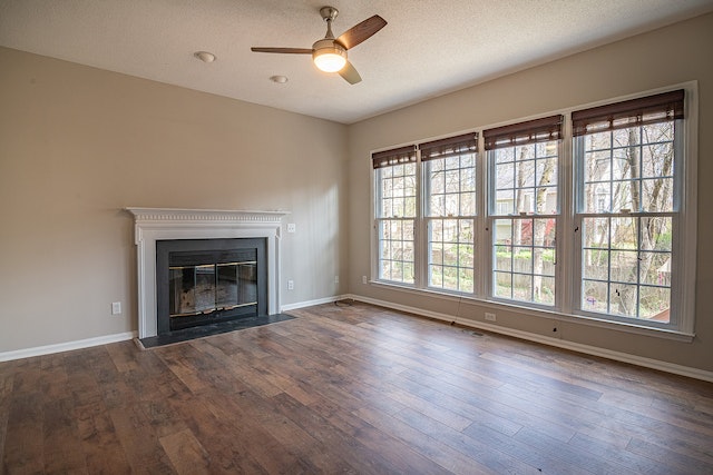 wide-shot-of-an-empty-room-with-dark-wooden-floors-and-tall-white-windows